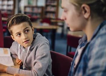 UB student helping a child